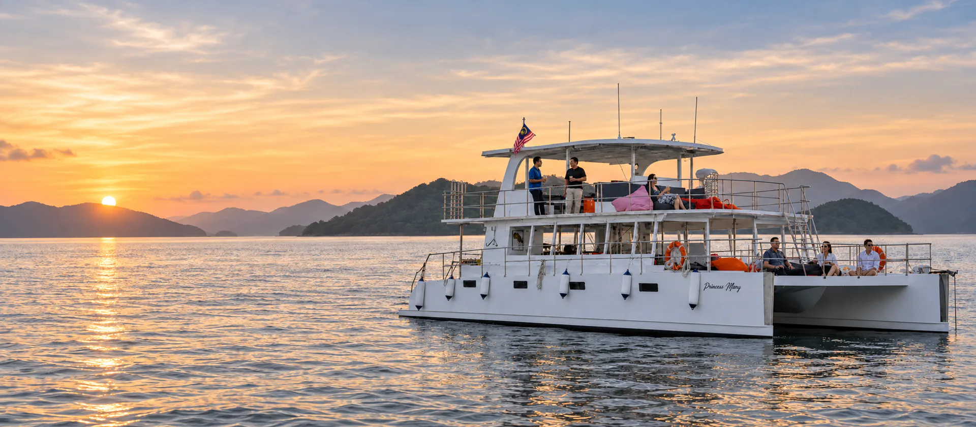 Guests aboard the open-air Princess Mary catamaran on a premium sunset cruise in Langkawi